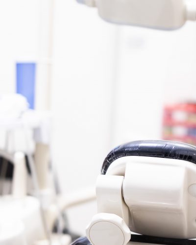 Dentist chair seen from behind. dentistry, medicine, medical equipment and stomatology concept. Vertical