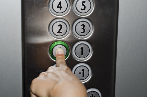 Pushing the button on the elevator